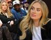 Adele looks stunning in chic black and white ensemble as she sits courtside ... trends now