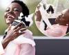 Lupita Nyong'o looks in good spirits as she cradles a cat while attending ... trends now