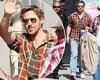 Ryan Gosling looks casual in a plaid shirt as he waves at fans while arriving ... trends now