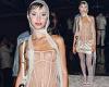 Iris Law catches the eye in a semi-sheer corset bustier and mini satin skirt as ... trends now