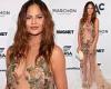 Chrissy Teigen dares to bare in SEE-THROUGH dress with sparkly floral appliques ... trends now