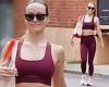 Olivia Wilde bares her washboard abs in burgundy sports bra and leggings while ... trends now
