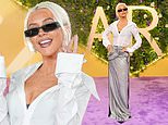 Christina Aguilera continues to show off her dramatic weight loss in a stylish shirt and shimmering skirt amid Ozempic rumours as she attends the Joy Awards in Saudi Arabia