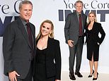 Reese Witherspoon looks effortlessly chic in a black dress and blazer as she poses with dapper Will Ferrell at the You're Cordially Invited UK screening in London